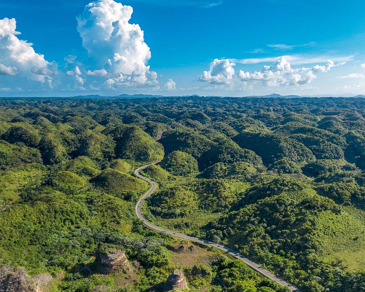 Clusters of tiny tree covered hills scatter across into the horizon in Los Haitises National Park